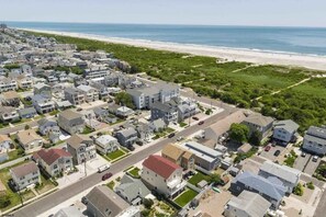 We are the red roof 5 houses to the beach!