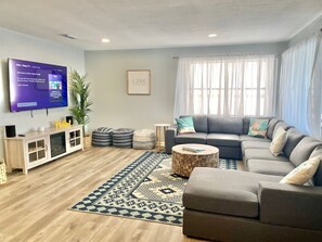 Large living room with 70" Smart TV