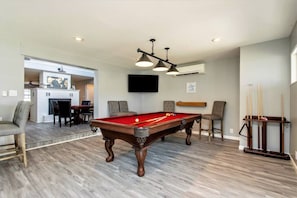 Shoot a game of pool while watching the big game or your favorite movie.