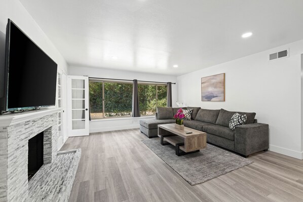 Cozy Living Room with 65-inch Smart TV and 7-Seater Sectional