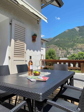 Drinks on the terrace with views to Alpe d’huez