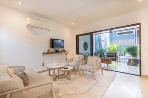 Living area with access to private pool