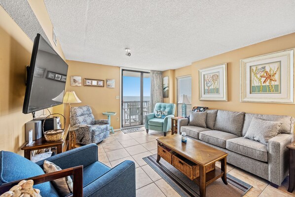 The ocean front living room is well-appointed with comfortable furnishings.