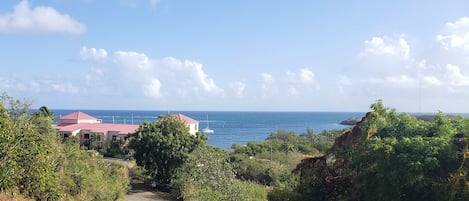 View from hill leading down to condo building.