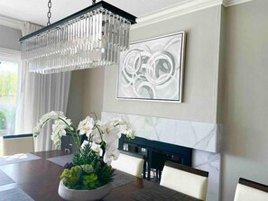 Large dinning table for 10 people for formal dining and family games of a large group.