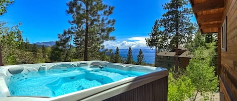 Private outdoor hot tub overlooking the lake