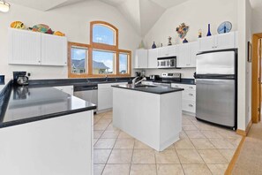 Bright kitchen with a chef's island for effortless cooking.