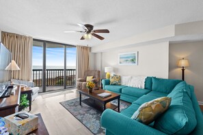 The private balcony off the living room invites you to step outdoors.