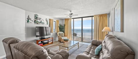 The ocean front living room is well-appointed with comfortable furnishings.