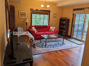 Living/dining room. Sliding glass door is private entry off patio.