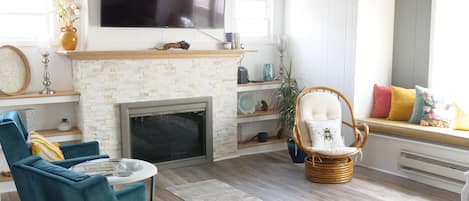 Living room area with window bench and large L shaped couch