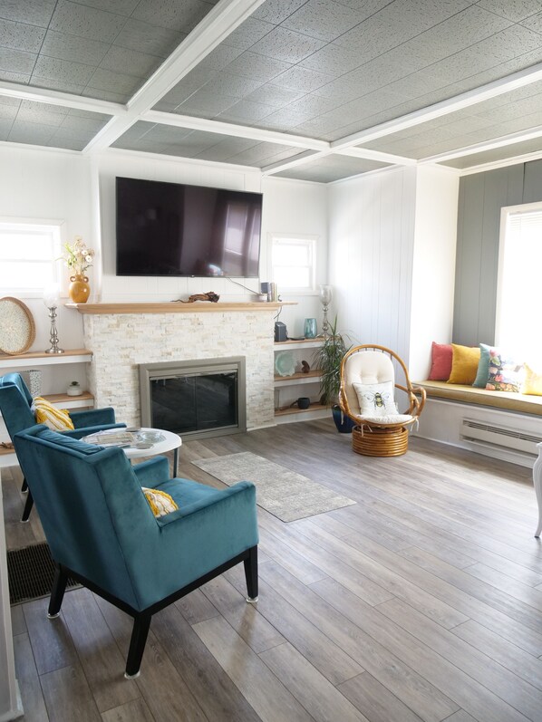 Living room area with window bench and large L shaped couch