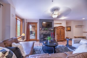 Living room--sectional sofa (Queen fold-out), fireplace, TV, DVD, private deck.