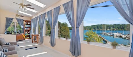 Relax in the sunroom overlooking Filucy Bay
