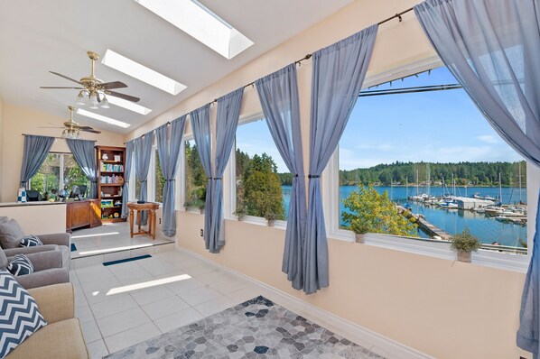 Relax in the sunroom overlooking Filucy Bay
