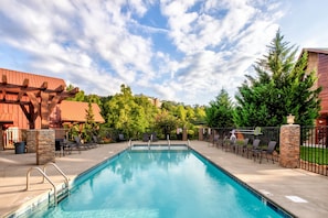 Enjoy the outdoor pool at Bear Cove Falls Resort as part of your stay!