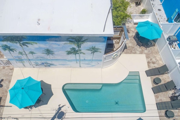 Aerial view of pool and mural wall at LuLu's Key House.