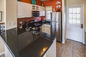 Key Lime Cottage provides ample counter space, making meal preparation and serving a breeze, ensuring convenience and functionality in the kitchen.