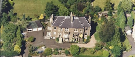 Aerial view of grand Victorian villa which houses Allan Stream Apartment