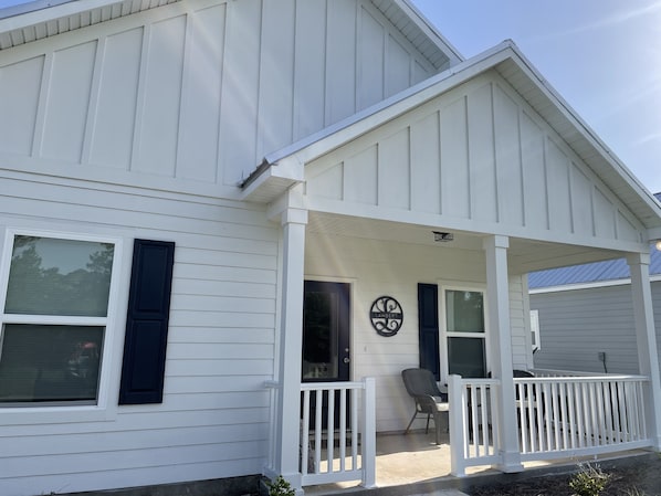 The Lambert Seaside is brand new construction with covered front and back porch