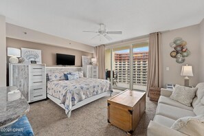 Main room with king size bed, couch and access to the balcony!