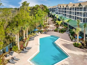 Building features a large outdoor pool