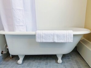 The carefully restored cast-iron clawfoot tub is as old as the building. Lay back, relax and have a soak. You deserve it.