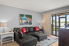 The private balcony off the main living room invites you to step outdoors.