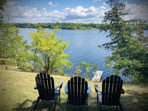 Relax in the Adirondack chairs overlooking the lake