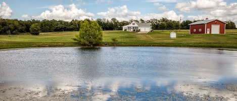 Pond view of house