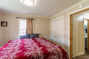 Bedroom 1 in front of house with King bed.