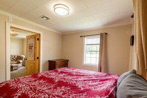 Bedroom 1 in front of house with King bed.