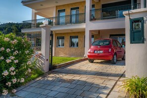 Main entrance and parking space