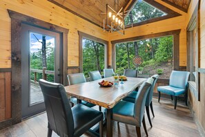 All glass dining room with door access to the porch 