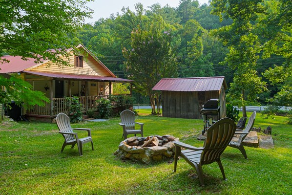 Backyard with Stone Fire Pit and Gas Grill