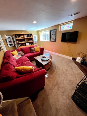 Brightly lit living room with gas fireplace