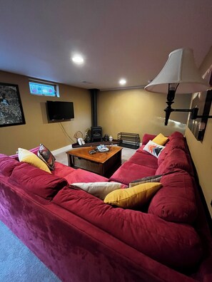 The living room has a gas stove heater