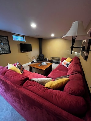 The living room has a gas stove heater