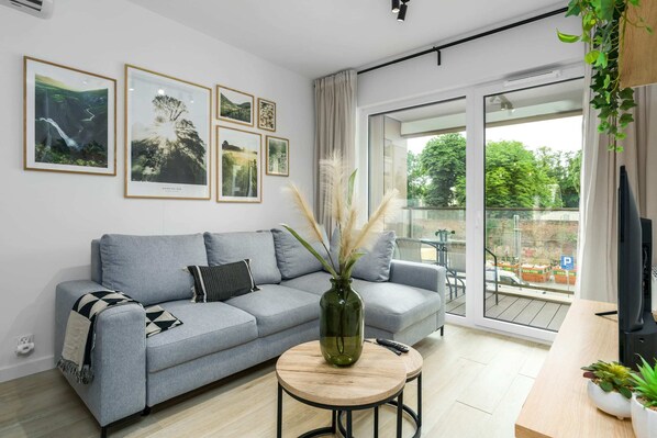 Living room with a comfortable sofa and TV.