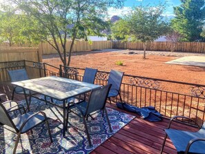 The fully fenced backyard is your own private refuge with a basketball court, deck with dining area and propane grill, and plenty of space to play. Your pets are welcome and they’ll love joining you here!