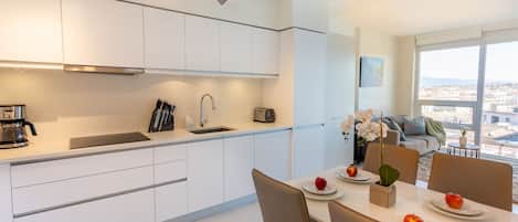 fully furnished kitchen with a dinning table of 4 extendable to 6 sittings
