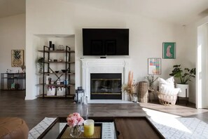 Beautiful living room with newly remodel fireplace, smart TV and board games!