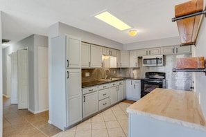 Bright kitchen fully stocked with all the cooking essentials 