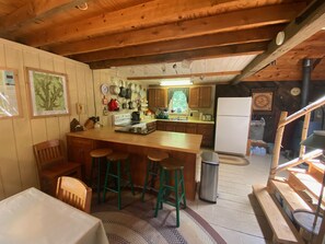 Fully equipped kitchen. Blender,crockpot and flat grill located in island.