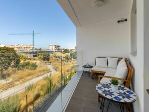 Plant, Sky, Table, Building, Chair, Tree, Shade, Outdoor Furniture, Line, Wall