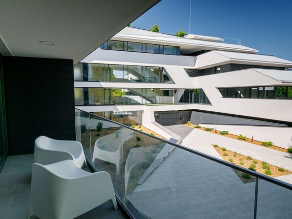 Property, Sky, Building, Shade, Architecture, Urban Design, Window, Condominium, Automotive Exterior, Chair