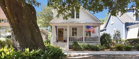 Front of house under the shade of a stately large Live Oak tree