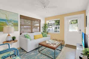 Front door leads to sun filled Living Room with Smart TV.