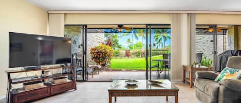 Living room with flat screen TV and lanai access