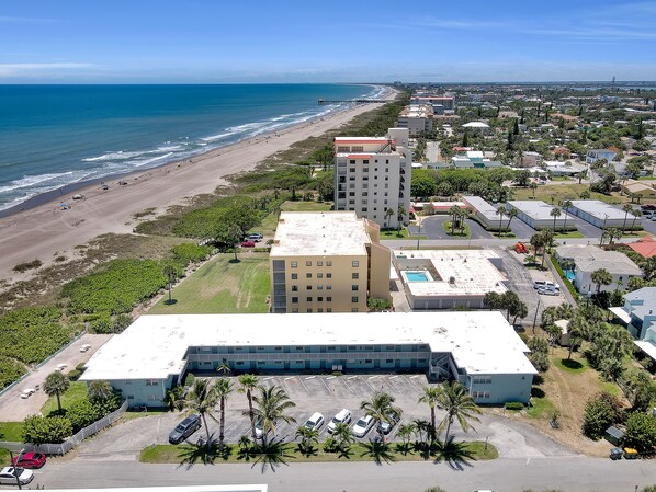 Our ocean  front building looking south, a close beach  walk to Cocoa Beach Pier